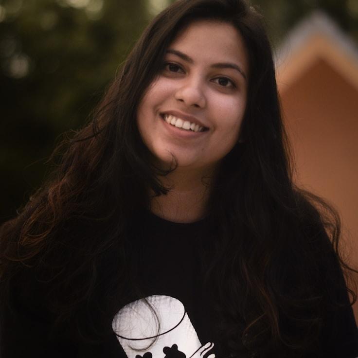A. Lee Chen, Lead Design Curator at QuillHarborGrove, reviewing corporate floral arrangements